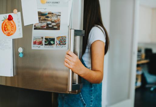 Women opening Double Door Refrigerator